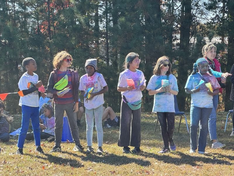 Students lined up outdoors, ready for a field day game
